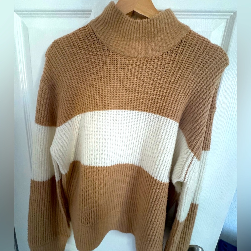 Beige and white striped turtleneck sweater